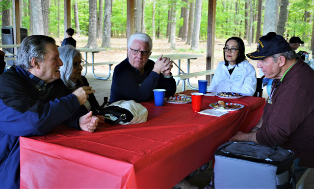 Rawl Gelinas, Paula Gelinas, Jerry Harrison, Nicki Harrison and Kenny Golden engage in telling sea stories. (Photography courtesy of Bert and Woody Wendell)