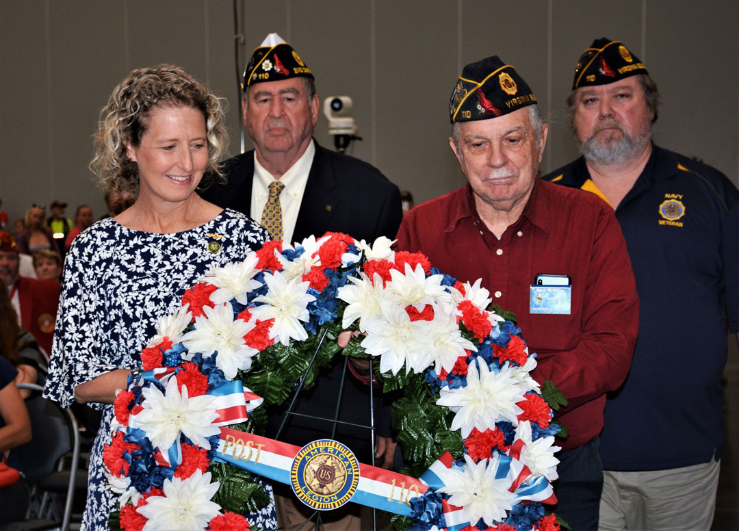 Photo: Post 110 members prepare to place a wreath to honor and remember our Nation's fallen veterans.  They are (left to right) Jen Kiggans, Virginia 2nd District U.S. Congresswoman and Post 110 member;  Fred Kinkin, 2nd District Commander; Mark McMillan, Post Sgt at Arms; and Rick Jones, Post Commander.  (Photography by Bert and Woody Wendell)