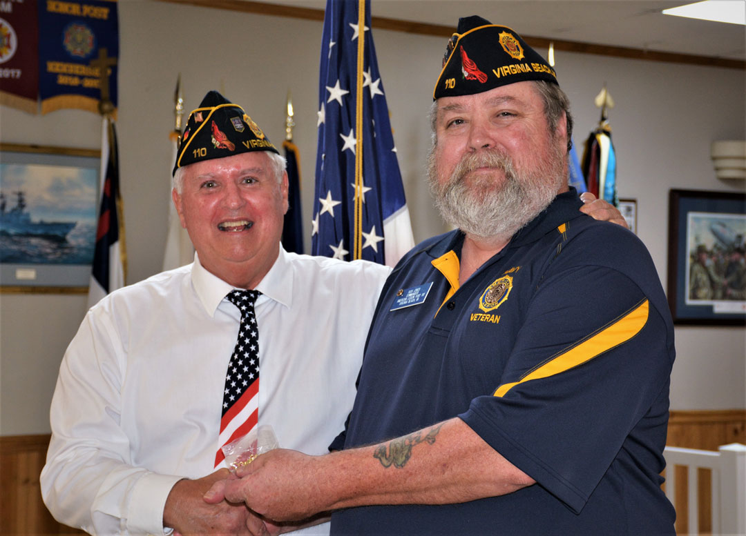 Ron Basso (left), Commander of the Staff Sergeant Robert C. Melberg, U.S. Army, American Legion Post 110 of Virginia Beach, VA presented an American Legion Past Commander's Lapel Pin to Rick Jones (right) for serving three years (2020-2023) as Commander. This ceremony took place on July 26, 2023 at the Post 110's monthly meeting.  (Photography by Bert Wendell, Jr.)