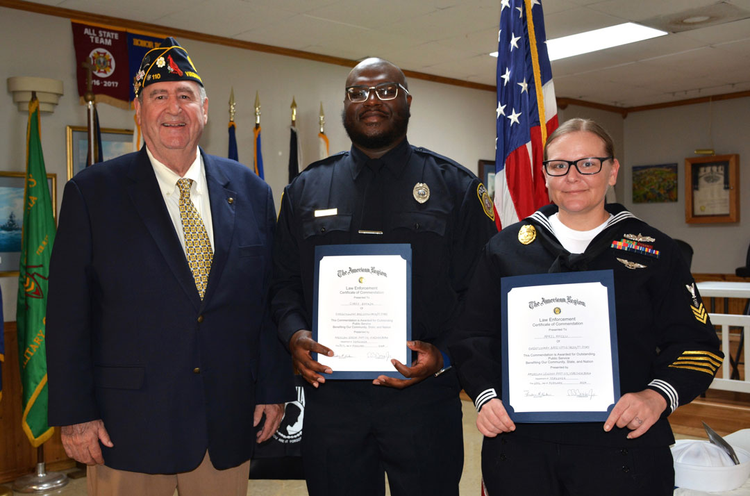 The SSgt Robert C. Melberg, U.S. Army, American Legion Post 110, Virginia Beach, VA awarded the 'American Legion Law Enforcement Certificate of Commendation' to Police Officer Corey Boykin, Jr. and Master At Arms First Class April Ancell, USN, both from the Police Department of Joint Expeditionary Base Little Creek-Fort Story, on February 28, 2024. Presenting the certificates was Fred Kinkin, Post Adjutant and Law Enforcement Coordinator.  The certificate reads as follows:  'This Commendation is Awarded for Outstanding Public Service Benefiting Our Community, State, and Nation'.  Photography by Bert Wendell, Jr.