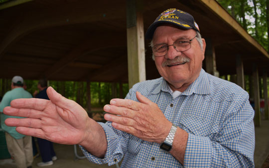 During a conversation about how two Navy ships passed in the night, Bob Russell uses his hands to illustrate how it was done. (Photography courtesy of Bert Wendell, Jr.)