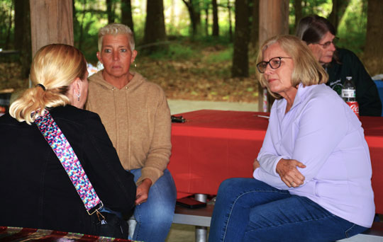 Engaged in a conversation, during a break in picnic activities, are (left to right) Tamara Netzel, Vicky Wendell and Mary Kinkin. (Photography courtesy of Bert Wendell, Jr.)
