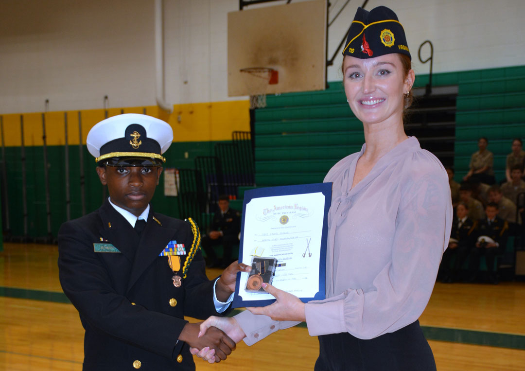 Legionnaire Emily Wolf presented the award for 'Military Bearing' to Cadet Hasani Jenkins. (Photography by Bert Wendell, Jr.)