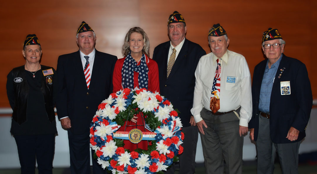 Pictured here: After the official 2024 Memorial Day Remembrance Ceremony, attending legionnaires gathered around the Post 110 Memorial Wreath for a group photograph.  In the photo (left to right) are Debbi Castrinos, Ron Basso, Jen Kiggans, Fred Kinkin, Mark McMillan and Bert Wendell, Jr.  (Photography by Woody Wendell)