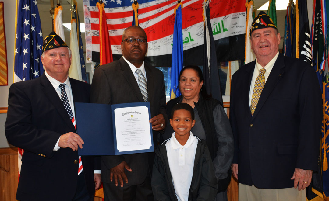 In the second photo (l to r) are Commander Basso, Police Officer Holmes, his wife Terri, grandson Brylon, and Adjutant Kinkin.  (Photography by Bert Wendell, Jr.)