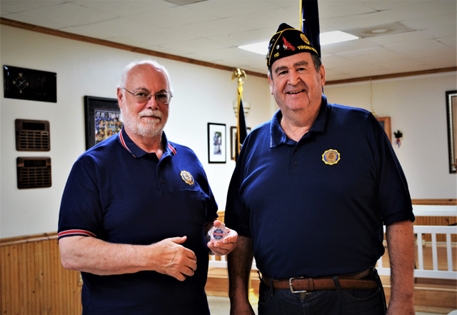Legionnaire Craig Huber (l) was presented with                              an American Legion Volunteer Appreciation Coin by                              Post 110 Commander Fred Kinkin (r) on March 11,                              2020 during the monthly meeting in VA Beach, VA.                              Huber, during his time as a member of Post 110,                              as contributed hundreds of volunteer hours and                              driven thousands of miles in support of the                              American Legion and military veterans. He also                              served as the Post Commander (2004-2005) and as                              the Post Web Master for many years. Craig and his                              wife, Vicky, will be moving near Myrtle Beach,                              South Carolina in the near future. (Photography                              by Bert Wendell, Jr.)
