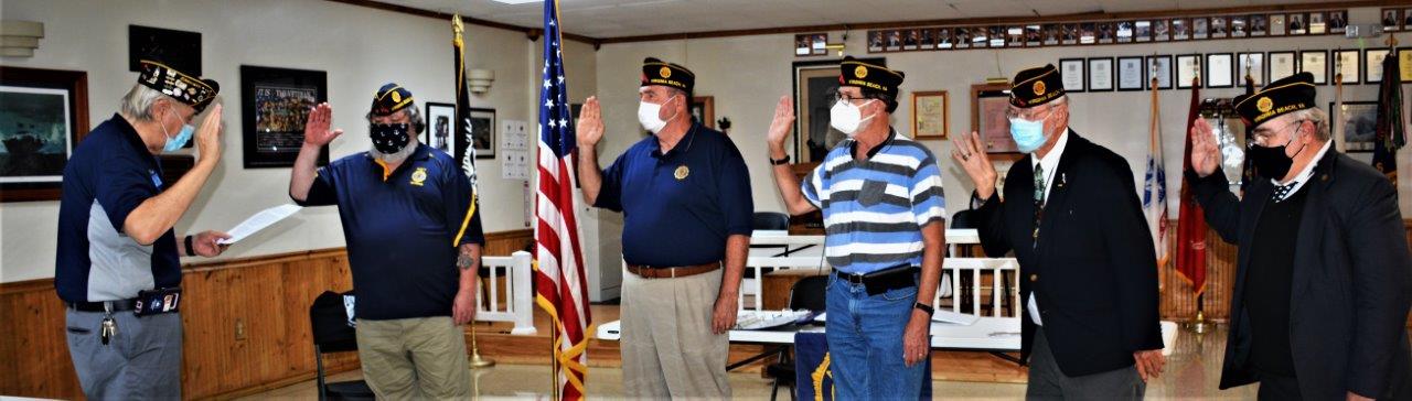 While social distancing and wearing face masks                              during the current pandemic, American Legion Post                              110 of VA Beach, VA held its' installation                              ceremony of 2020-2021 officers on August 26,                              2020. Conducting the ceremony was Wayne Mead (l),                              Post 113 Commander and Past Commander of the 2nd                              District. In the photo (left to right) are Wayne                              Mead; Rick Jones, Post Commander; Fred Kinkin,                              Adjutant; Jon Asher, Finance Officer; George                              Schmidt, Chaplain; Jeff Kocab, Sergeant at Arms;                              absent were Eric Bell, Service Officer and Bert                              Wendell, Jr., Historian. (Photography by Bert                              Wendell, Jr.)