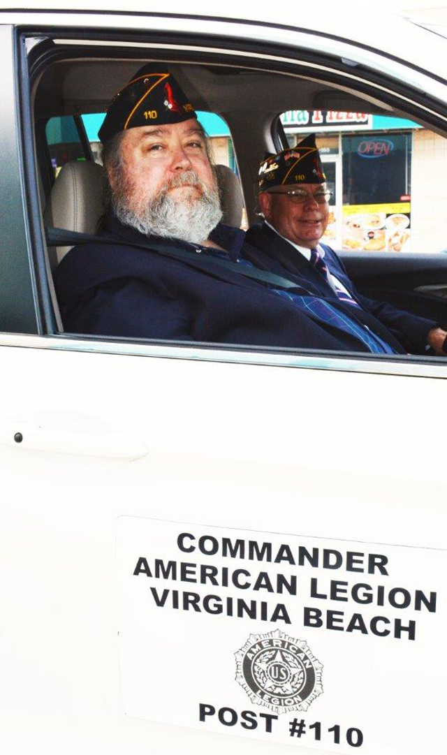 American Legion Post 110 Commander Rick Jones and Chaplain David Smith in the Commander's vehicle (Photography by Bert Wendell, Jr.)