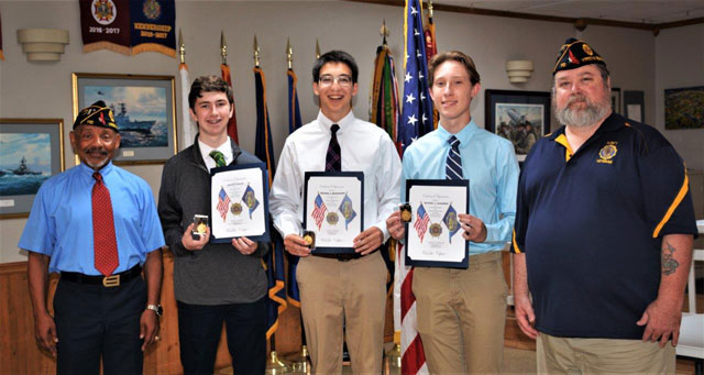American Legion Post 110 of Virginia Beach, VA presented certificates and medals to three Catholic High School students on July 27, 2022.  The students successfully completed the Virginia Boys State Program which was held on June 19-25, 2022 at Radford University..  Receiving the awards were Kevin Shook, Michael Beauchamp, and Michael Olkowski. Making the presentations were Post 110 Commander Rick Jones and Wendell Parker, Post 110 Boys State Coordinator.  The Boys State Program is one of the nation's most respected and selective high school education programs for the study of government and civics, in which participants learn by engaging in the functions of local, county, and state governments.  In the photo (left to right) are Wendell Parker, Kevin Shook, Michael Beauchamp, Michael Olkowski and Rick Jones.  (Photography by Bert Wendell, Jr.)