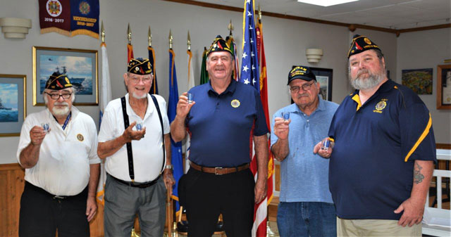 Five legionnaires from American Legion Post 110 of Virginia Beach, VA received American Legion Shot Glasses for completing over 100 hours of volunteer time in support of our nation's military veterans.  Making the presentations was Commander Rick Jones at the post's monthly meeting on July 27, 2022.  Bob Russell was also given a $20 gift card for having the most volunteer hours.  In the photo (left to right) are Jeff Kocab (183 hours), George Schmidt (113 hours), Fred Kinkin (143 hours), Bob Russell (194 hours) and Rick Jones (107 hours).   (Photography by Bert Wendell, Jr.)