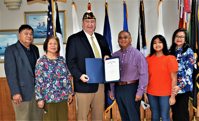After the presentation of the 'American Legion Law Enforcement Certificate of Commendation', Commander Fred Kinkin joined Jesse Posadas and his family for an informal group photograph.  In the photo (left to right) are Allen Caasi, Elsie Caasi, Commander Kinkin, Jesse Posadas, Maribeth Posadas and Betty Posadas. Photography by Bert Wendell, Jr. 